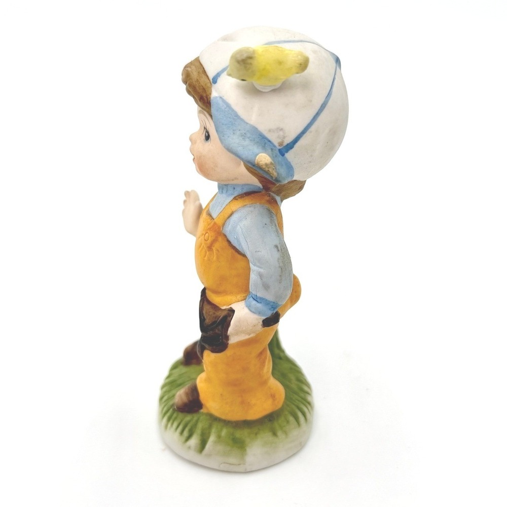 Vintage Bisque Porcelain Boy Figurine Slingshot Bird Hat Orange Overalls - Picture 2 of 6